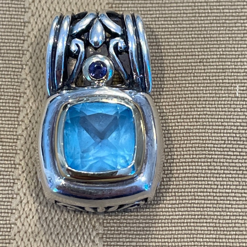 Sterling silver and 14kt gold blue topaz pendant